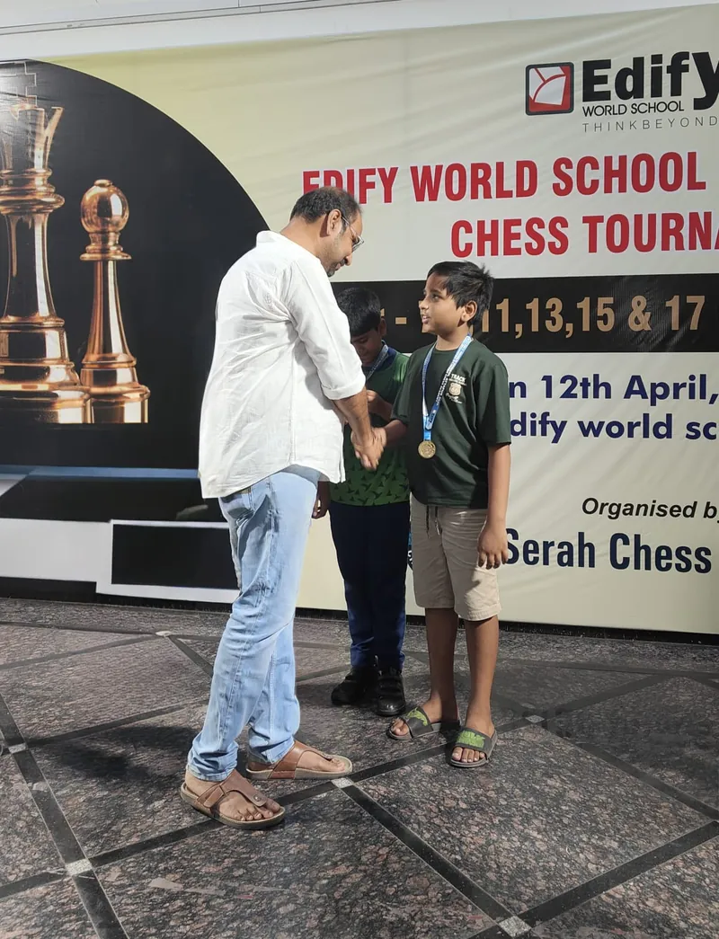 Jiyansh receiving medal at Edify World School Chess Tournament