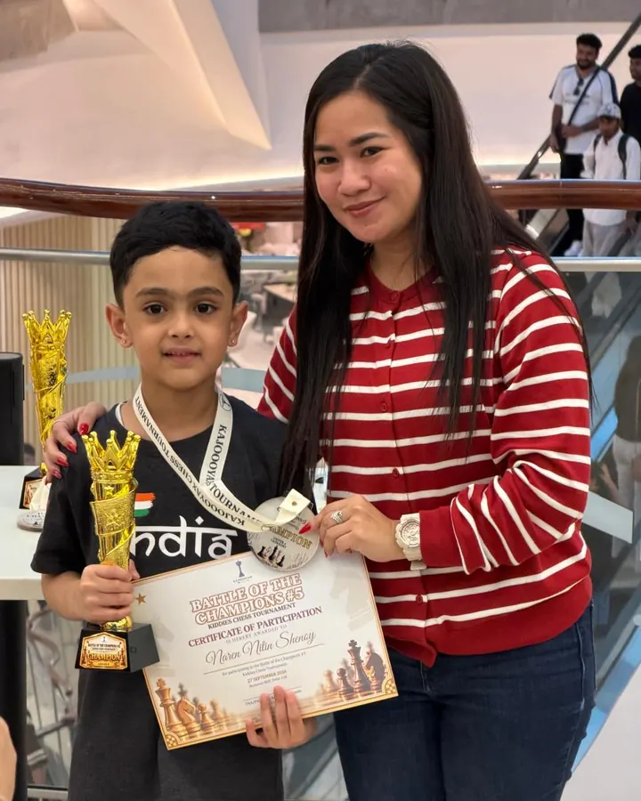ChessWize student with a trophy at Battle of the Champions #5