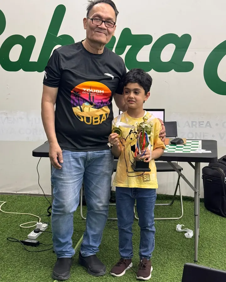 ChessWize student with a trophy