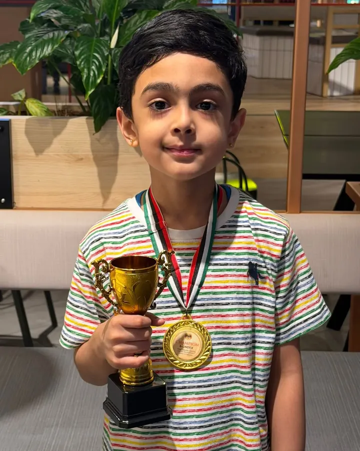 ChessWize student with a trophy